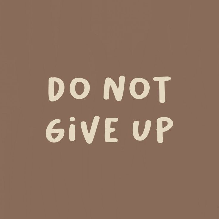 the words don't give up are written in white on a brown background,