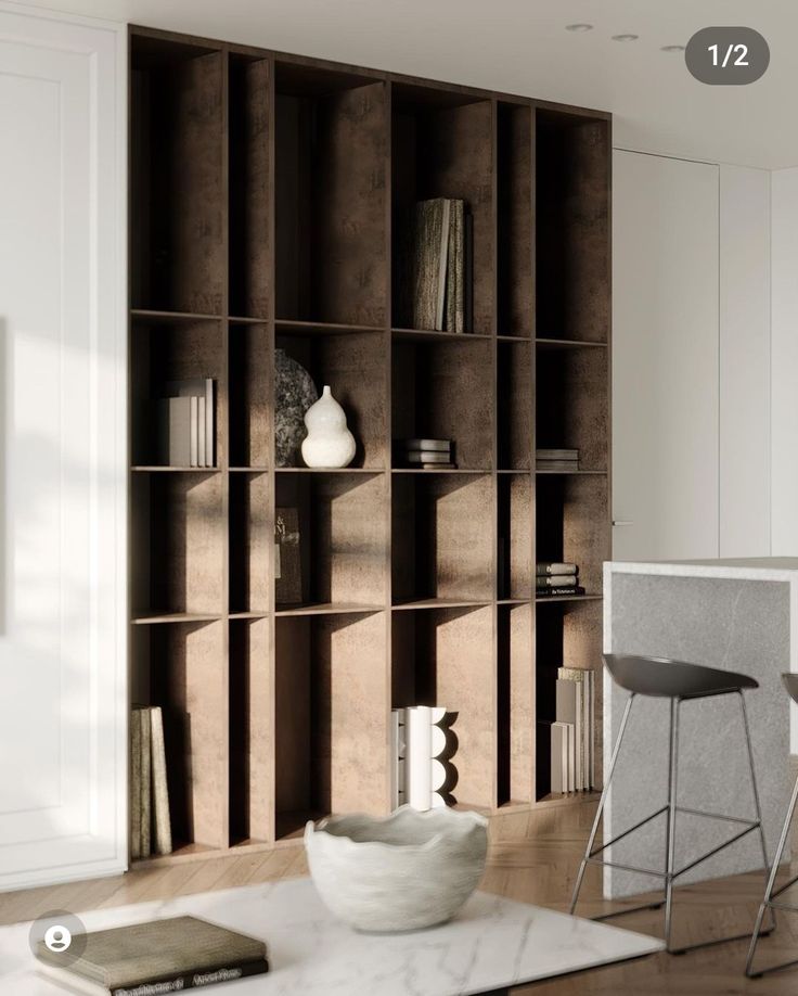 a living room filled with furniture and a book shelf