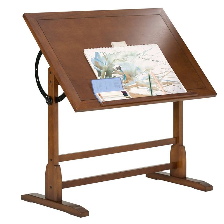 a wooden desk with a magazine holder on it's top and an open notebook in the middle