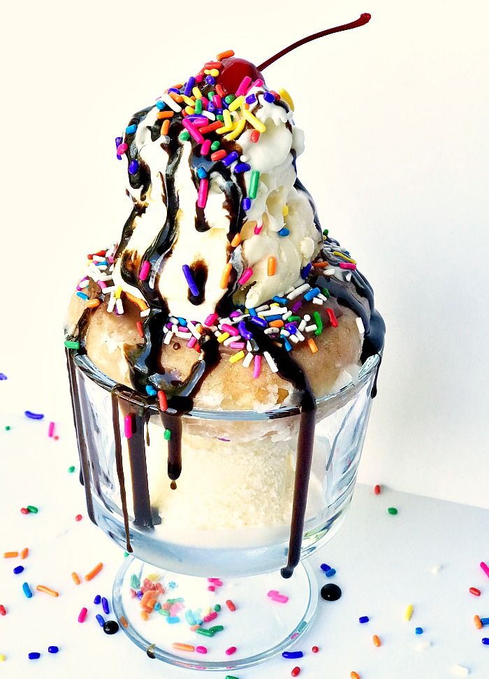 an ice cream sundae with sprinkles and chocolate