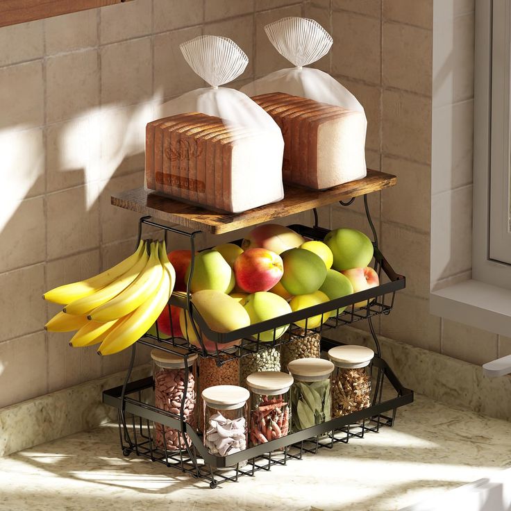 two trays filled with different types of food on top of a counter next to a window