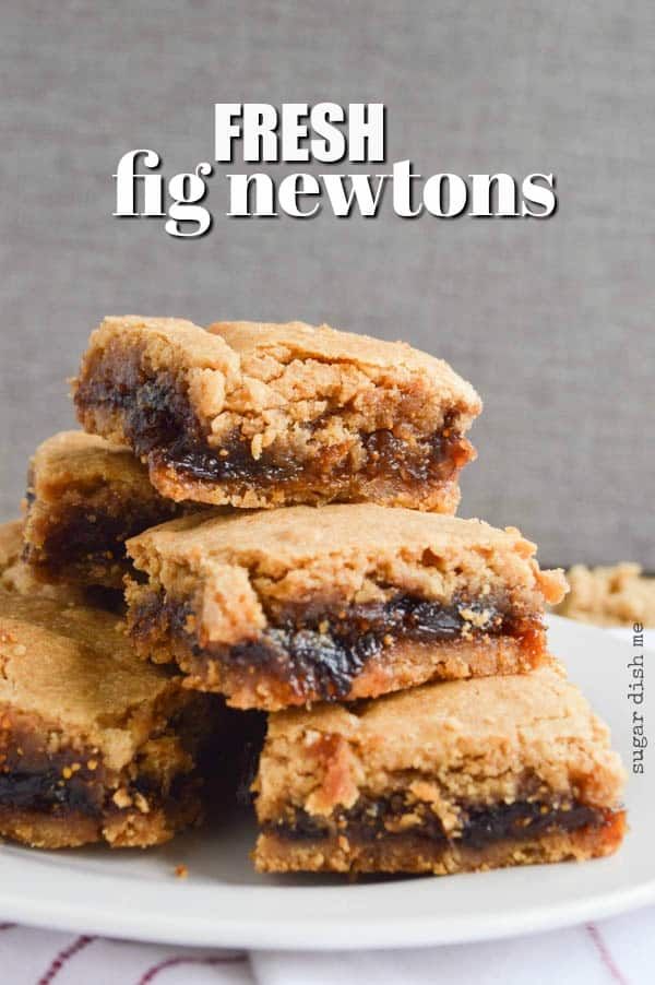 fresh fig newtons stacked on top of each other in front of a white plate