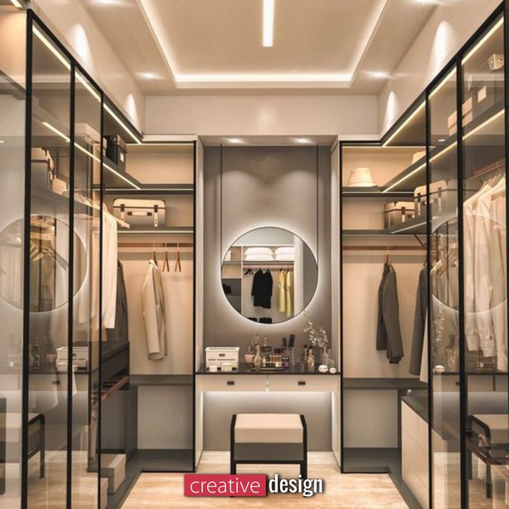 a walk in closet with mirrored walls and lights