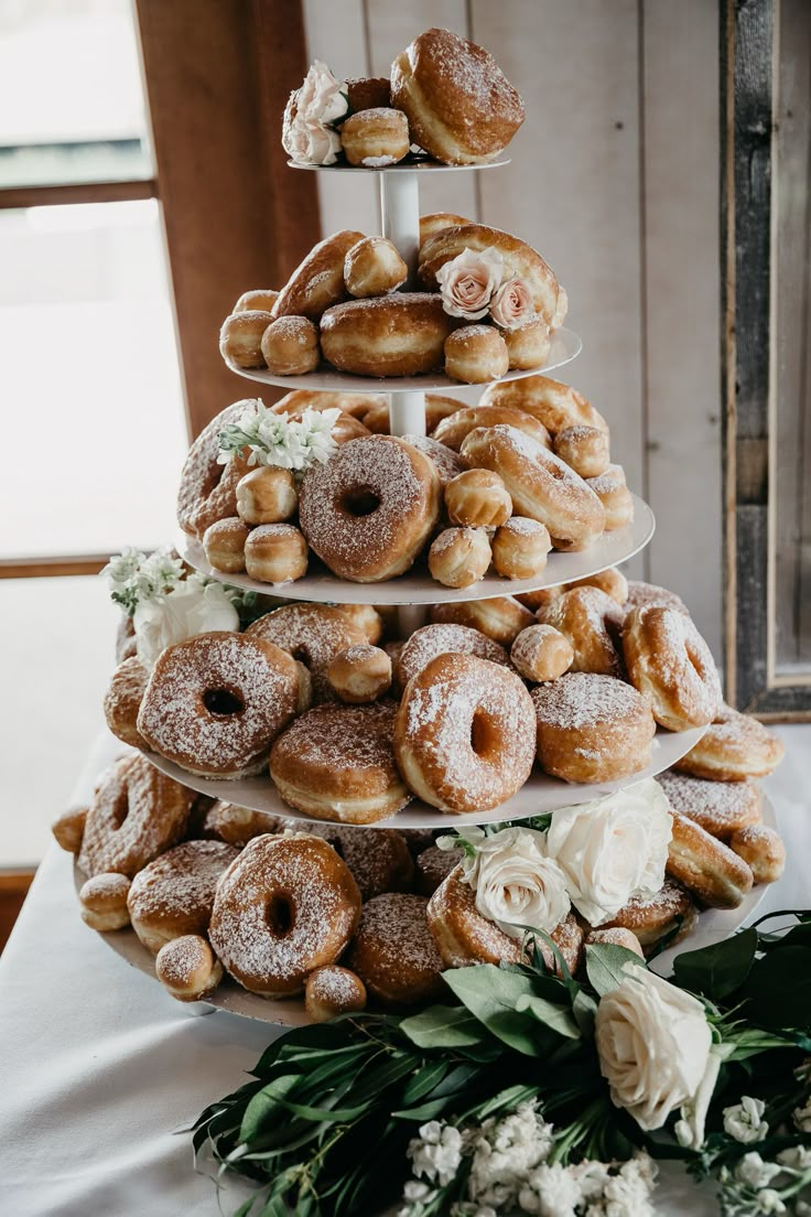 a tower of donuts sitting on top of a table