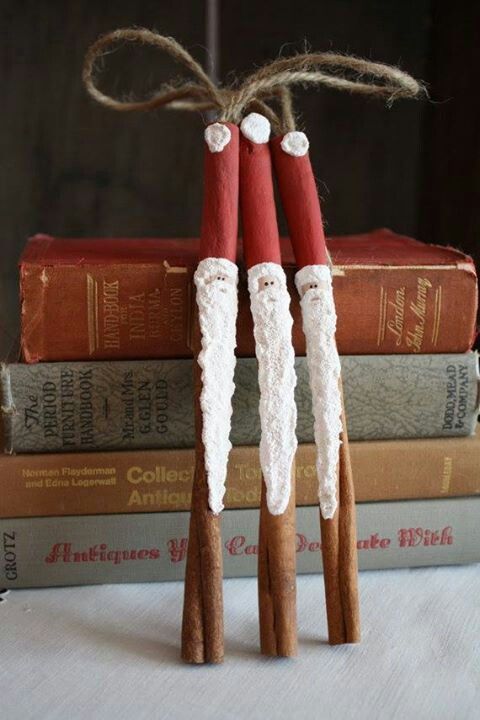 two red and white wooden sticks are tied to some books with twine on them