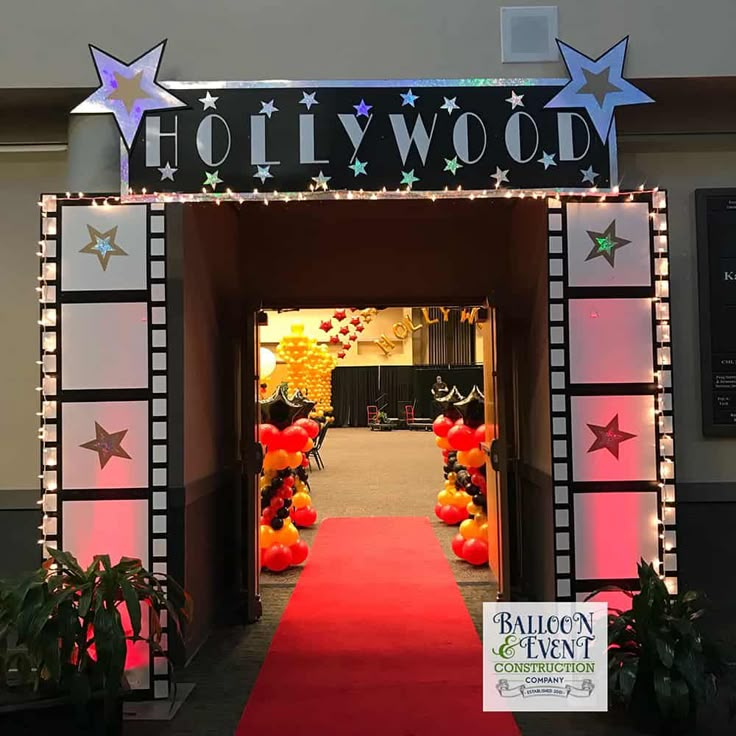 the entrance to hollywood is decorated with balloons and stars