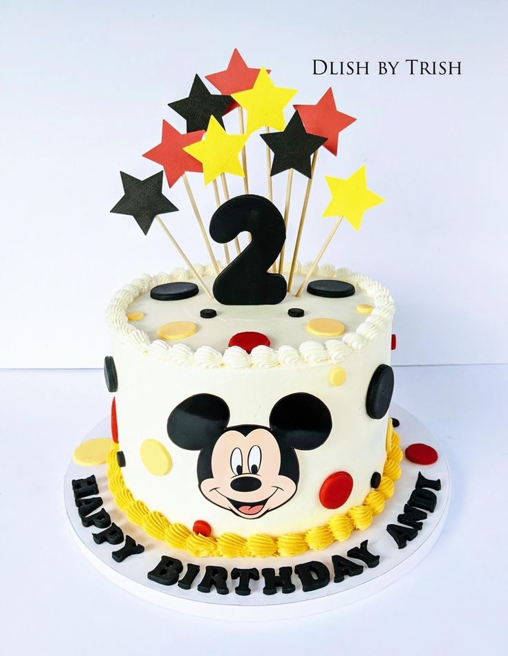 a mickey mouse birthday cake with stars on top