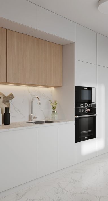 a kitchen with white cabinets and marble counter tops, along with a black stove top oven