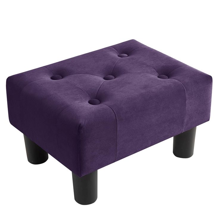 a purple foot stool with black legs and buttons on the top, in front of a white background