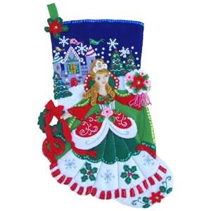 a christmas stocking with a woman in the center and snowflakes on it