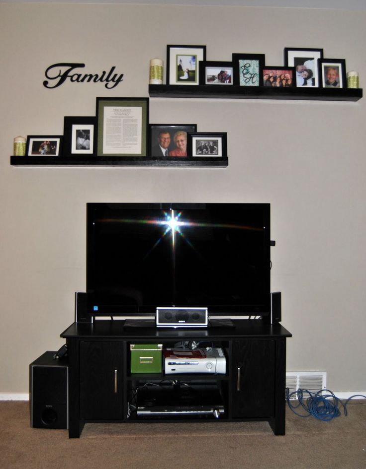 a flat screen tv sitting on top of a black entertainment center