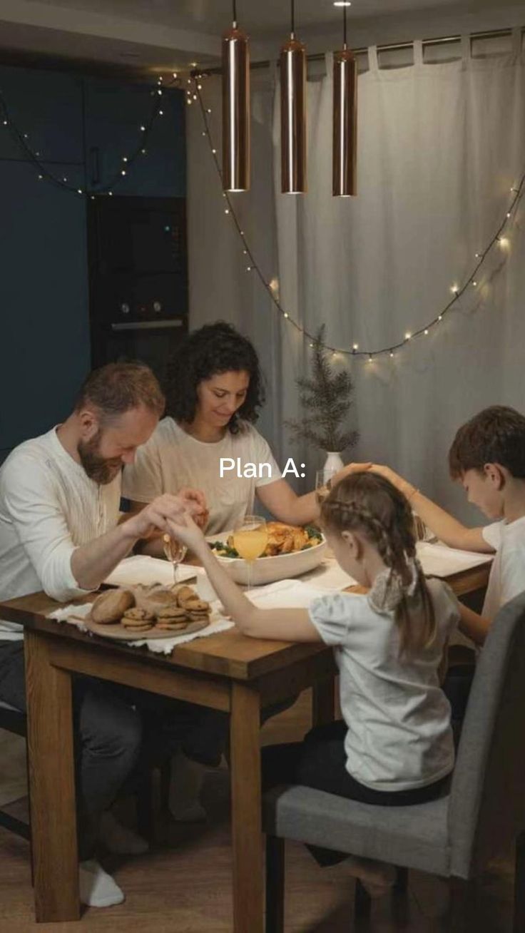 a group of people sitting around a table eating food