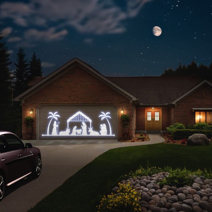 a car parked in front of a house with christmas lights