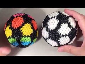 two crocheted balls in the shape of soccer balls being held by someone's hands