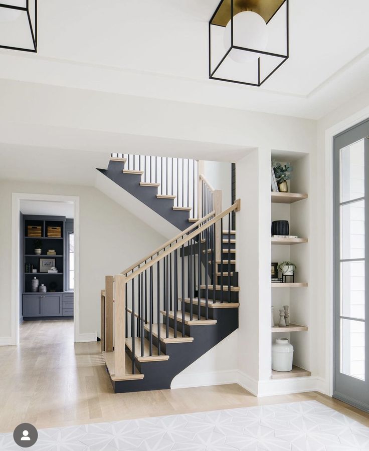 a staircase in the middle of a living room