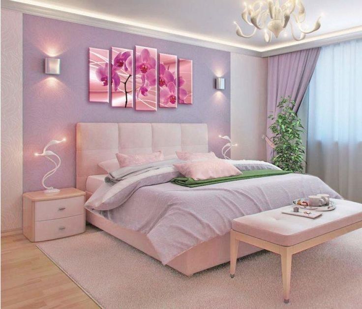 a bedroom with purple walls and white furniture