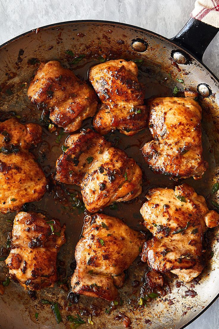 some chicken is cooking in a skillet on the stove top and it's ready to be cooked