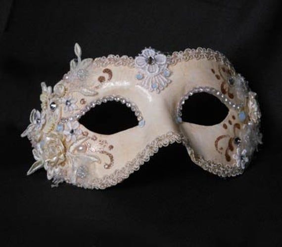 "This mask belongs to our collection of masks \"Into the White\", originally born for a special wedding and then further developed. This mask is a traditional and original papier-mache Venetian mask, handmade and decorated in our Atelier in Venice using acrylics colors, fabrics, Svarowski and the crequelè technique. It is perfect for any masquerade party, Halloween costume, pro or event in Venice or elsewhere during Carnival. This mask can be gently bent to form to your face and ties in the back Maskerade Mask, White Masquerade Mask, Masquerade Mask Diy, White Masquerade, Masquerade Ball Masks, Masquerade Ball Mask, Venice Mask, Venetian Masquerade Masks, Mask Aesthetic