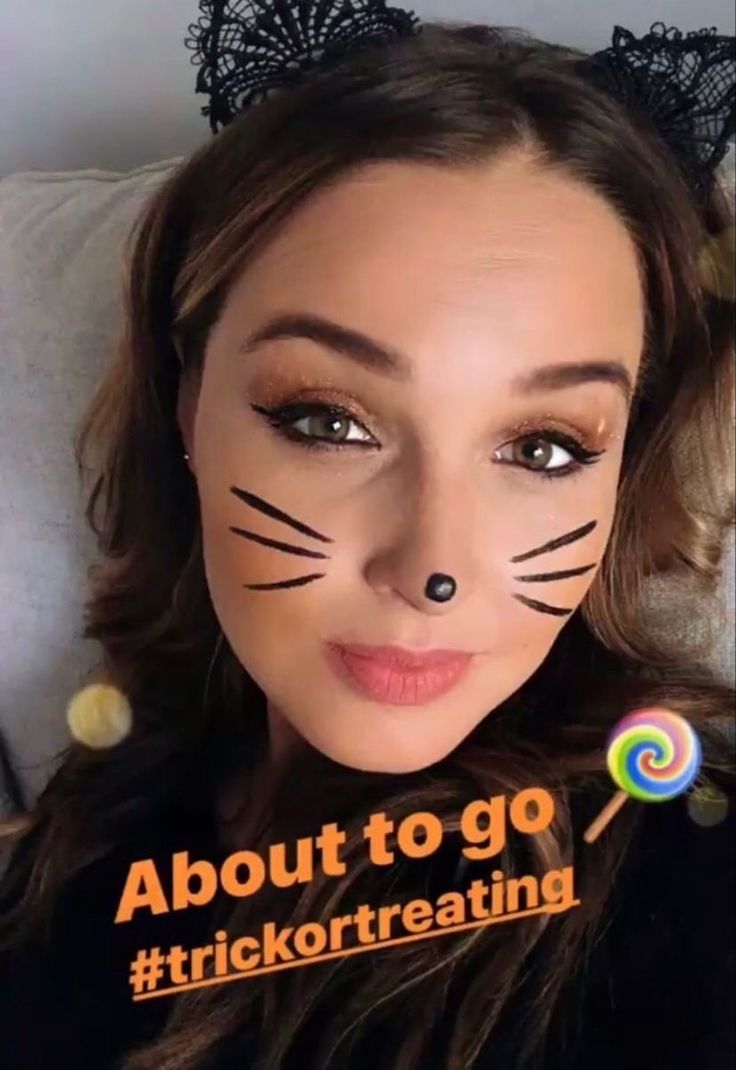 a woman with cat ears on her face and the caption about to go trick or treating