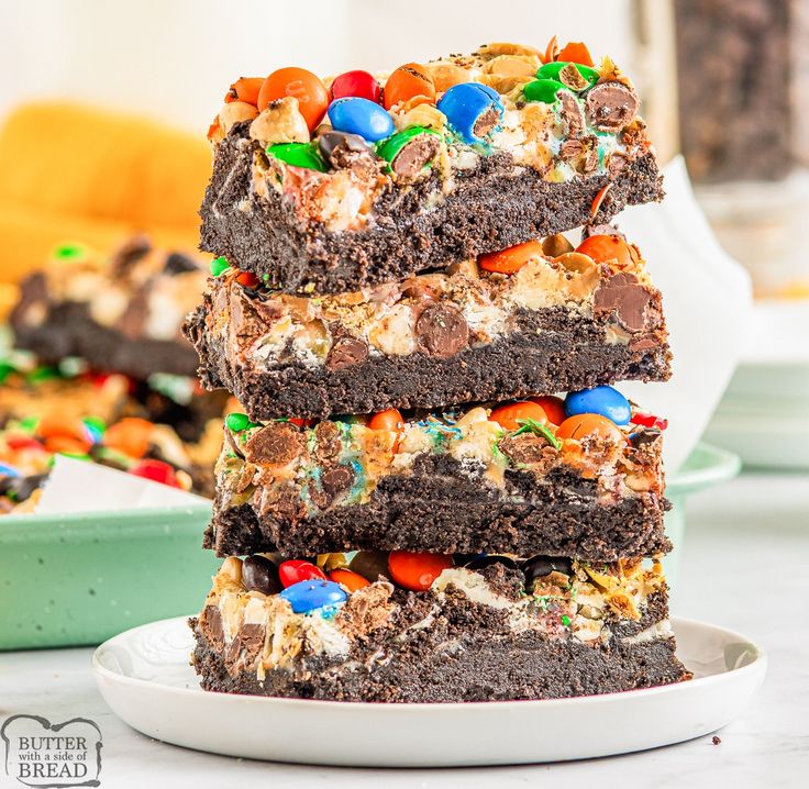 a stack of brownies topped with m & m candy bars