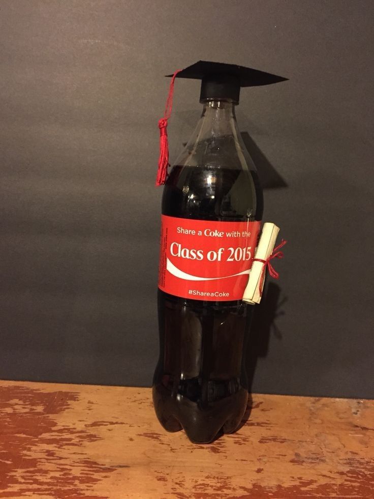 a graduation cap on top of a bottle