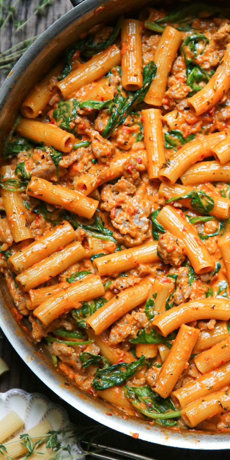 Creamy Sausage Rigatoni with Spinach, Garlic, and Tomato Cream Sauce in a stainless steel pan. Tuscan Rigatoni, Creamy Sausage Rigatoni, Rigatoni Recipe, Sausage Rigatoni, Rigatoni Recipes, Oven Meals, Tomato Cream Sauce, Resep Pasta, Italian Sausage Recipes