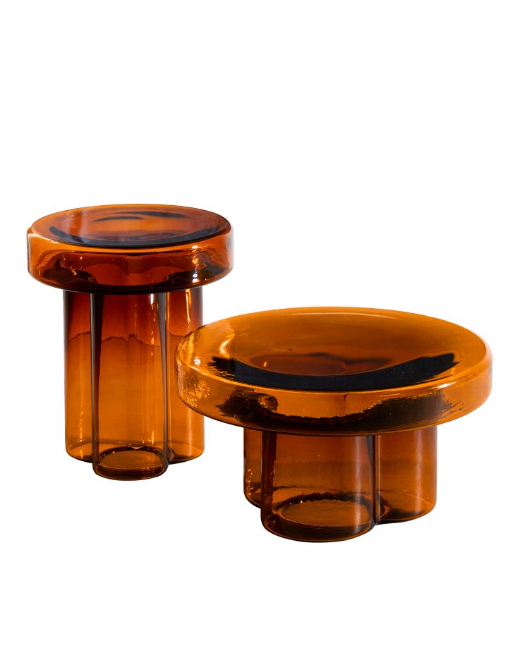 two brown glass tables sitting next to each other