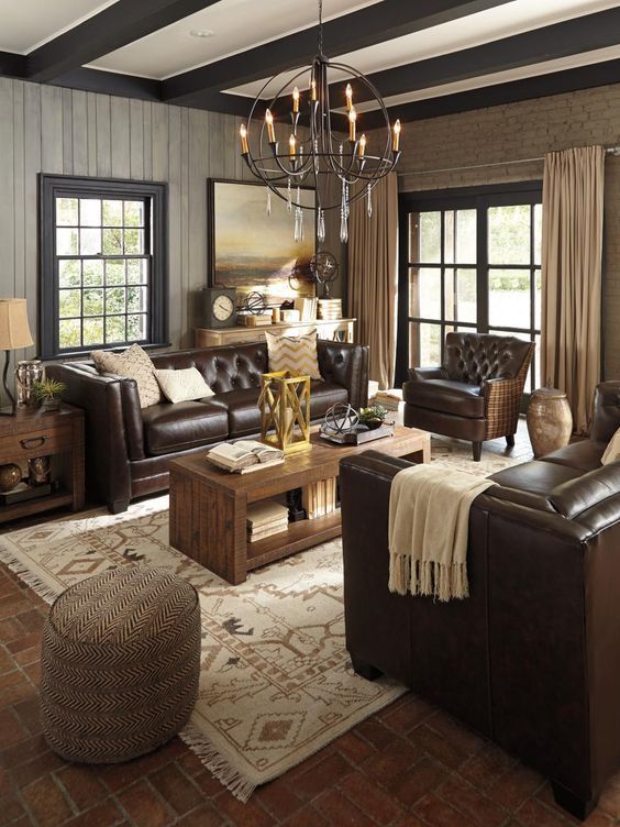 a living room filled with furniture and a chandelier