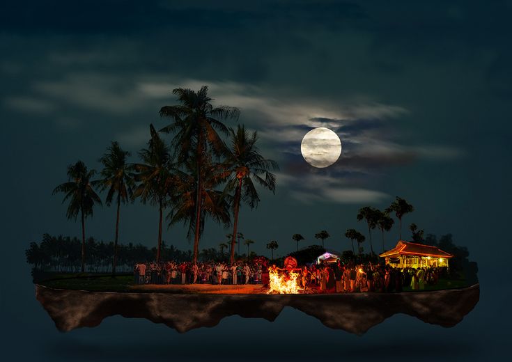 a group of people standing on top of a floating island in the ocean at night