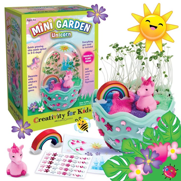 an image of a toy set in the grass with flowers and rainbows on it