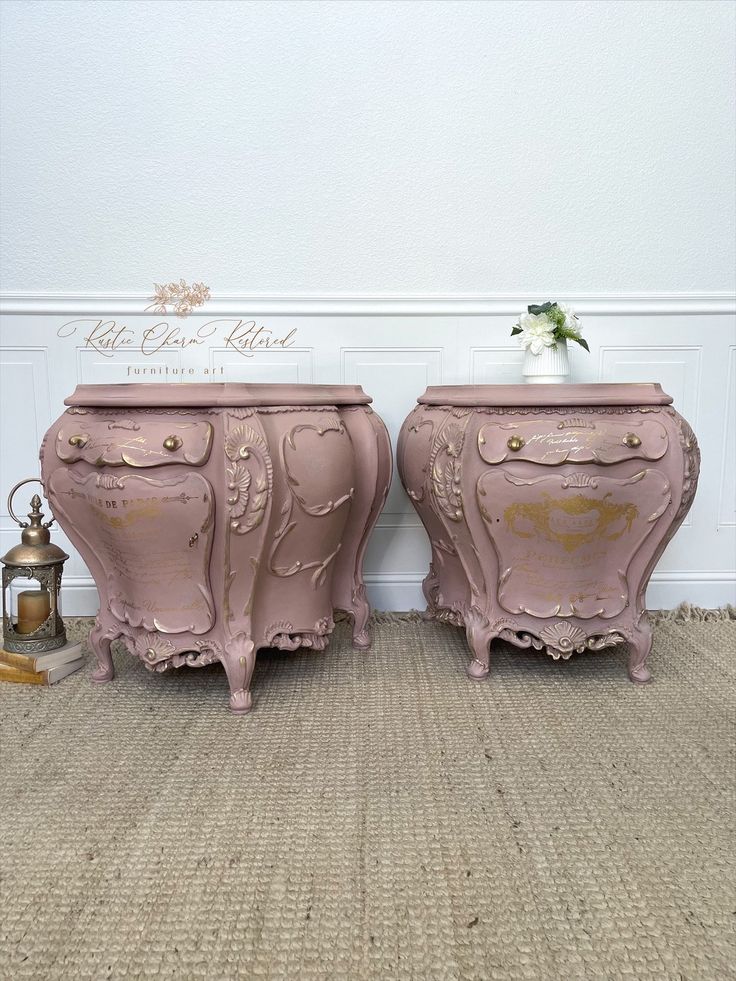 two pink chests sitting next to each other on top of a carpeted floor in front of a white wall