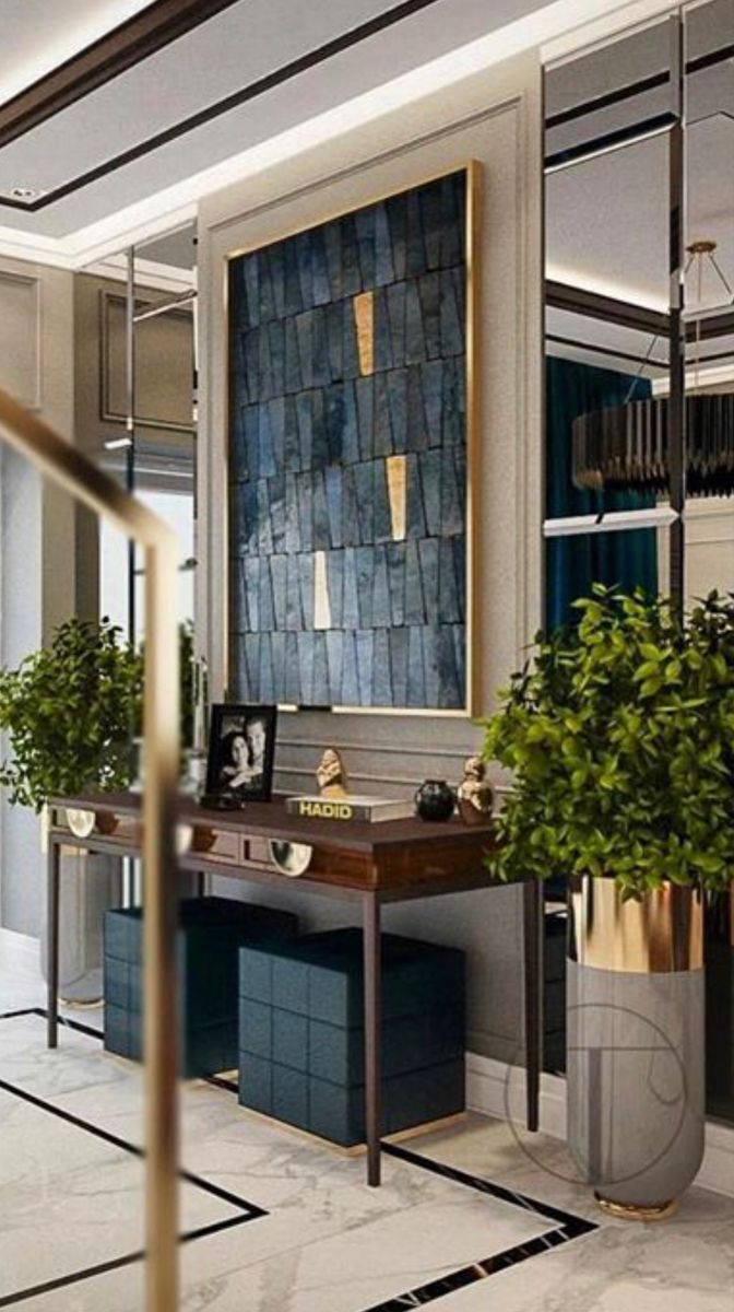 a large mirror sitting above a desk in a room with potted plants on it