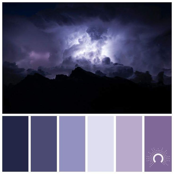 the sky is filled with purple and blue hues as it appears to be lightning