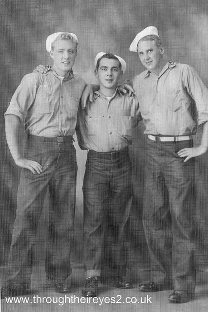 three men in sailor's uniforms posing for a photo