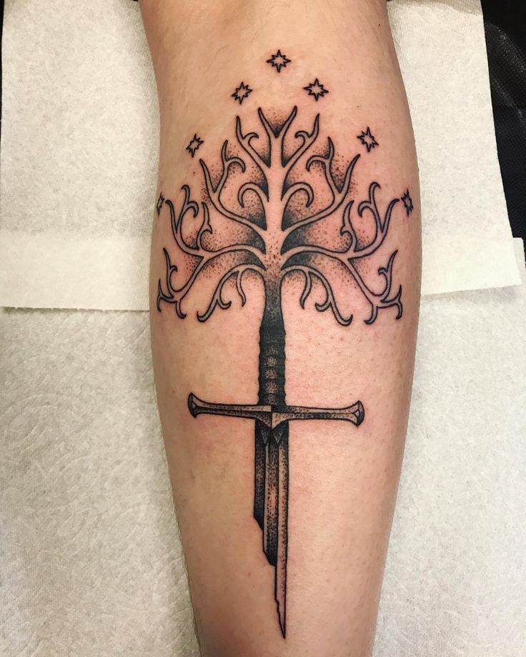 White Tree of Gondor/Shard of Narsil by Chance Gomez from Collective Tattoo Parlor in Las Vegas NV. Tree Of Gondor Narsil Tattoo, Lotr White Tree Tattoo, Lotr Tree Tattoo, Trees Of Valinor Tattoo, Shard Of Narsil Tattoo, Gondor Tattoo, Narsil Tattoo, Tree Of Gondor Tattoo, Tolkien Tattoo