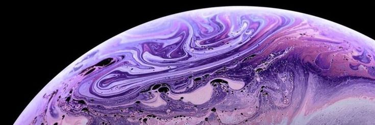 an iphone with purple and blue swirls on it