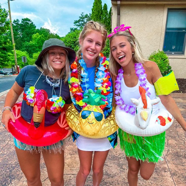 three girls in costumes posing for the camera