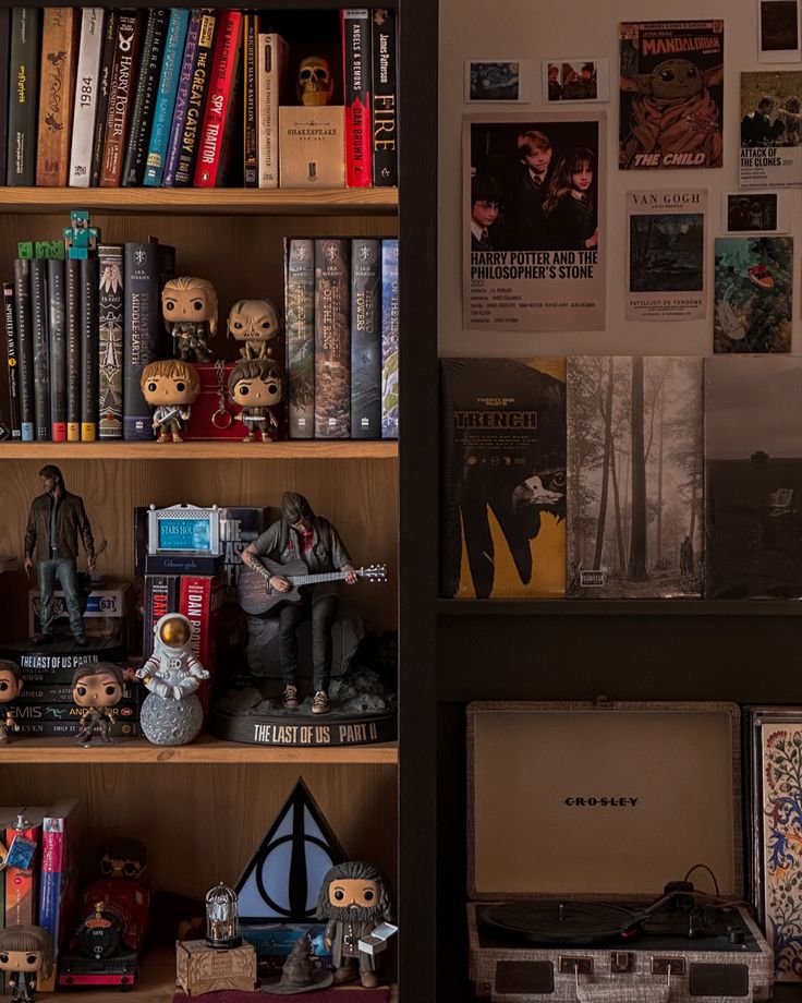 a bookshelf filled with lots of books and figurines