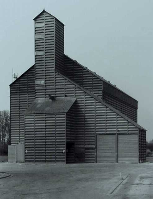 an old black and white photo of a large building