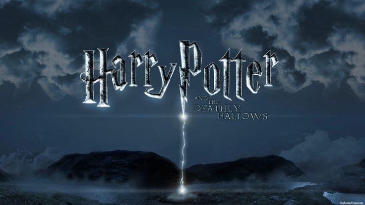 harry potter and the deathly hallows logo on a dark sky with clouds in the background