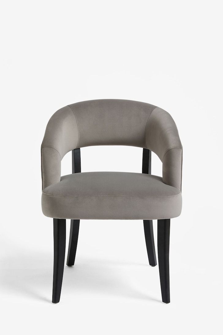 an upholstered chair with black legs and a grey fabric seat, on a white background