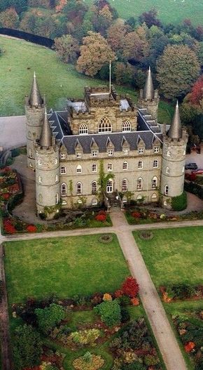 an aerial view of a castle in the countryside