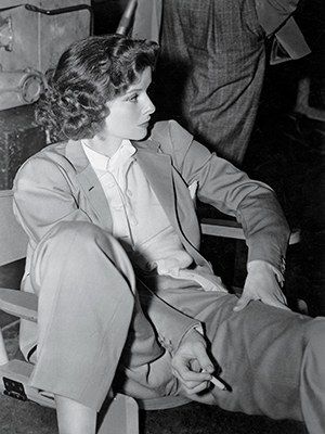 black and white photograph of a man sitting in a chair