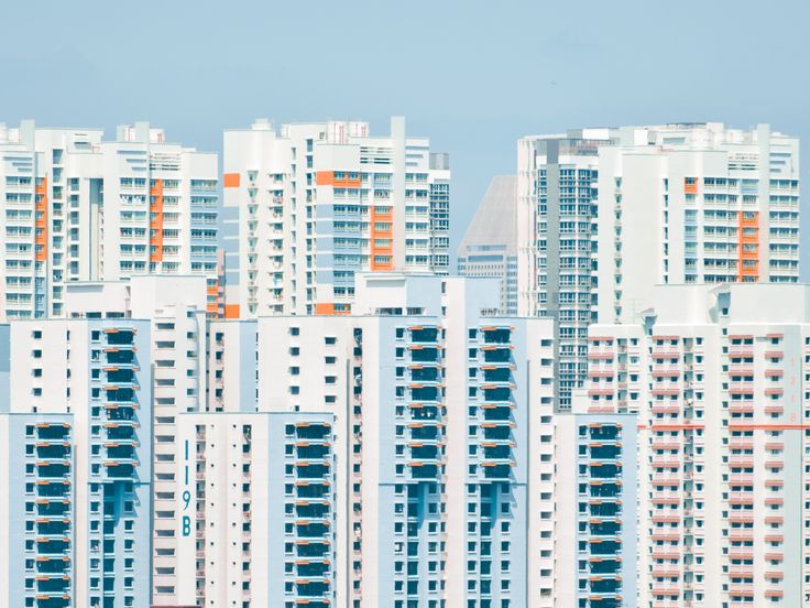 many tall buildings with balconies in the background