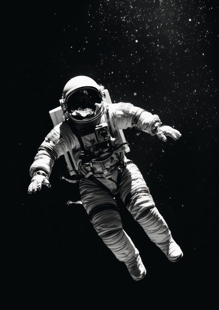 an astronaut floating in the air with his arms outstretched and feet apart, wearing a spacesuit