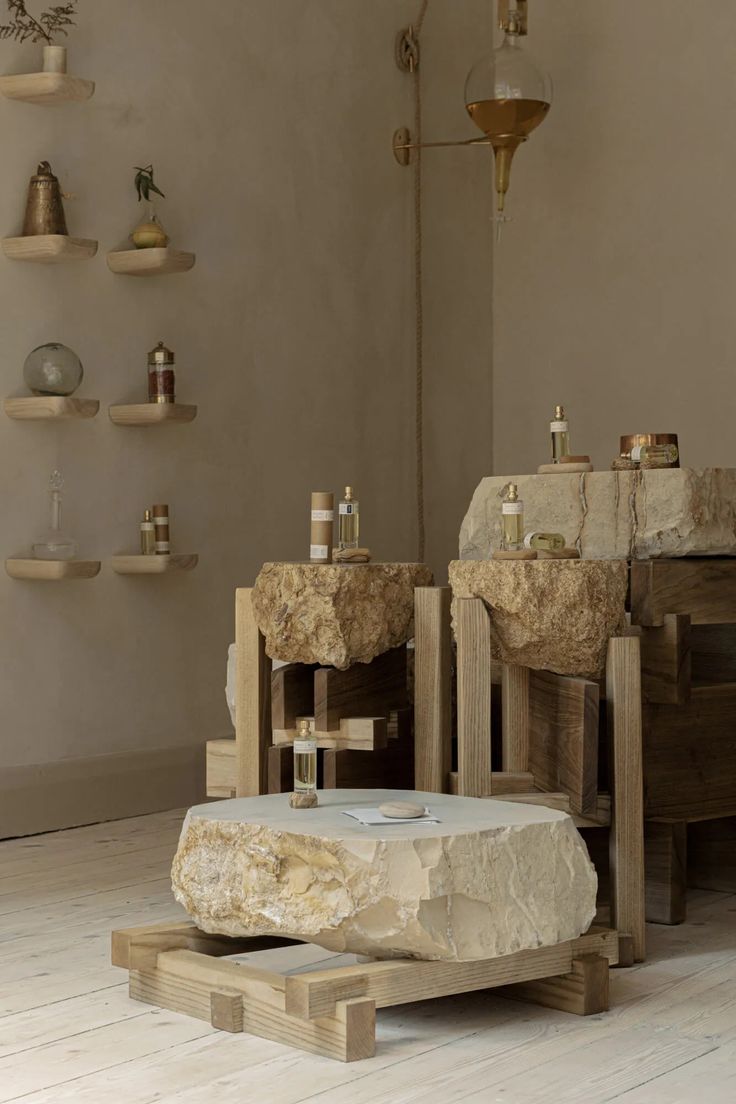 two stone sinks sitting next to each other in a room