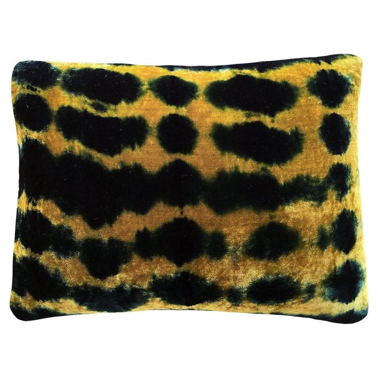 a black and yellow animal print pillow on a white background