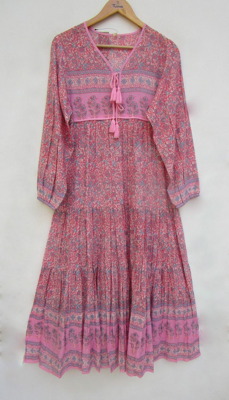 "ITEM DESCRIPTION pink blues regular wear printed maxi dress - v neckline with tassel maxi dress - long sleeve boho maxi dress Features: Long sleeve, V neck, Long dress Material: Cotton Voile Fabric: 100% cotton soft light weight ethnic print fabrics  Sleeve Length = 22 inch For more sizes & their measurement, please refer our below chart to understand the sizes variations available with us For your size requirement, please mention your size in seller note at the time of buying. SIZE MEASUREMENT  BUSTLENGTHSHOULDER XXS34 inch51 inch13.5 inch XS36 inch51 inch14 inch S38 inch51 inch14.5 inch M40 inch51 inch15 inch L42 inch51 inch16 inch XL44 inch51 inch16.5 inch 2XL46 inch51 inch17 inch 3XL48 inch51 inch18 inch   Company Return Policy:  Please write for more information to my email directly Spring V-neck Maxi Dress With Back Tassel Tie-up, Spring Maxi Dress With Back Tassel Tie-up, Spring Boho Maxi Dress With Back Tassel Tie-up, Spring Floor-length Printed Boho Dress, Summer Boho Maxi Dress With Block Print, Long Boho Dress With Floral Print In Hippie Style, Spring Long Dress With Tassels, Long Spring Dress With Tassels, Floor-length Boho Dress With Boho Print For Spring