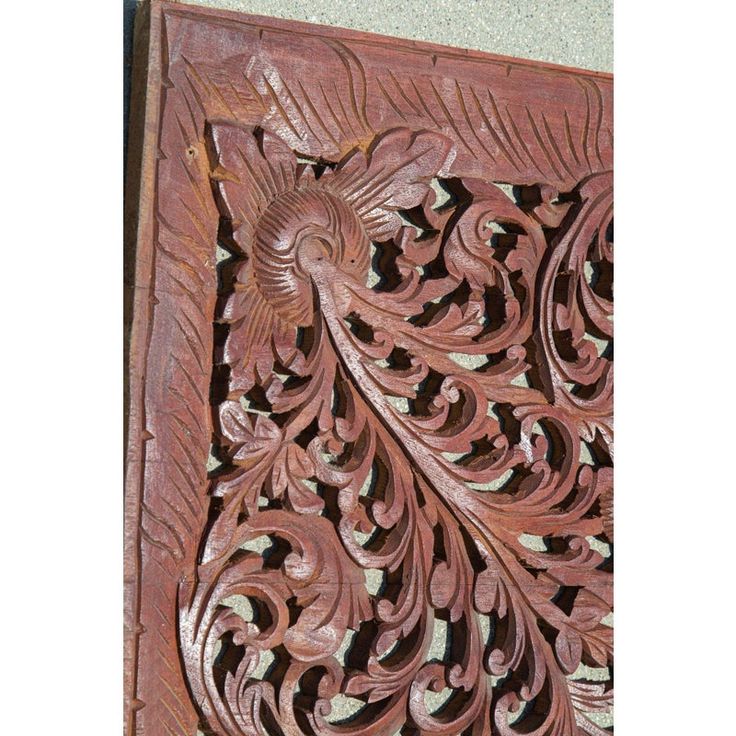 an intricately carved wooden panel on the wall