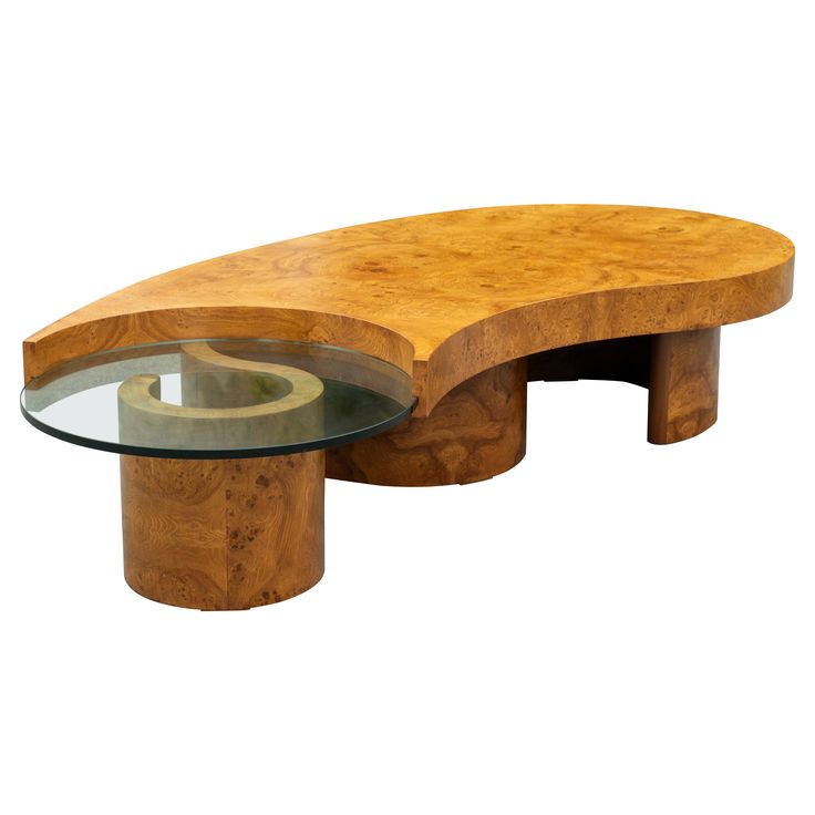 a table with a glass top and curved wooden structure on the bottom, sitting in front of a white background